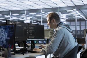 Technician using artificial intelligence technology to optimize data center workplace. Machine learning expert in server hub using AI tech to streamline operations and accurately forecast issues photo