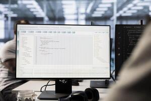 Admin in server hub workplace ensuring compliance with industry standards and regulatory requirements. Data center IT professional conducting security audits to protect against errors photo