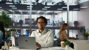 Professional employee at his office desk working on report writing, working on project management and deadline. General manager looking to expand the organization globally, multitasking. Camera B. photo