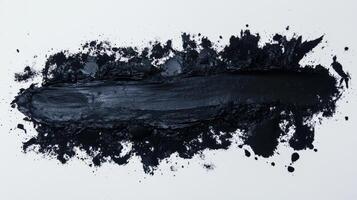Black paint brush stroke on white background for abstract art concept and texture photo