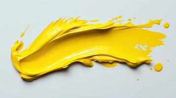 Vibrant yellow paint stroke on white background capturing artistic creativity photo