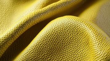 Close-up texture of yellow leather fabric with detailed grain patterns photo