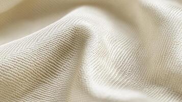Close-up of beige textured fabric with curved surface patterns and light shadows photo