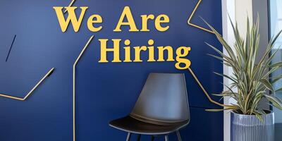 Modern Office Space with Hiring Announcement and Chair photo