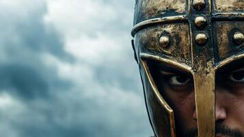 Fierce Gladiator Warrior in Ancient Helmet Against Stormy Sky Backdrop photo