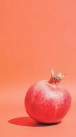 Vibrant Pomegranate on Bold Red Background Capturing Minimalist Elegance photo