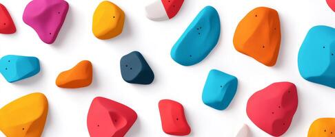 Colorful Assorted Climbing Holds Isolated on White Background for Wall Setup photo