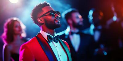 Stylish Man in Red Tuxedo and Sunglasses at Elegant Evening Party photo