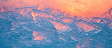 Creative abstract patterns formed by frozen ice shards with a colorful background photo
