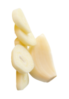 A peeled white garlic clove with slices in pile isolated with clipping path in file format png