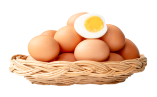 Large group of raw brown chicken eggs and peeled cooked or boiled eggs with egg yolk in half in stack in wicker basket isolated with clipping path in file format png