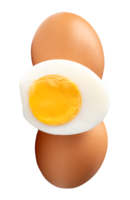 Two raw brown chicken eggs and cooked or boiled chicken egg with egg yolk in half in stack isolated with clipping path in file format Top view photo of eggs png