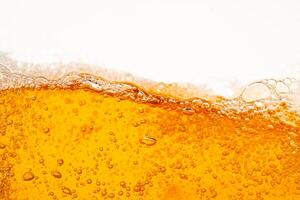 Close up bright orange Oil or beer splash texture and nature waves, Beautiful waves curve and little bubbles smooth for graphic design and background Oil Bubbles photo