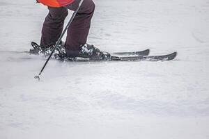 Close-Up of Skier in Action on the white snow photo