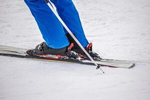 View of the boots on the ski on the mountain slope photo