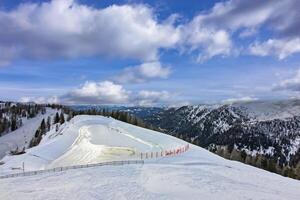Snowy alpine landscape with glacier lake - Bad Kleinkircheim in Austria photo