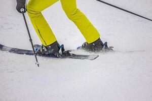 Skier in Action on the white snow photo