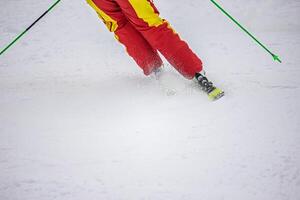 View of the person on ski on the mountain slope photo