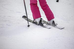A person on the ski on mountain slope photo
