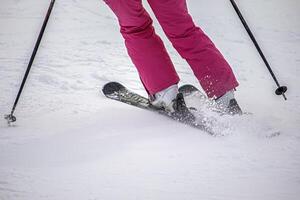 A person on ski on the mountain slope photo