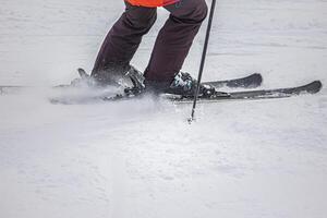 View of the skier in action on the white snow photo