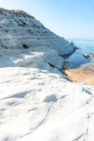 the piece of coast in Sicily called the Scala dei Turchi during a sunny day. photo