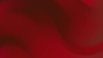 Red gradient background features subtle swirling movement and tiny speckles. video