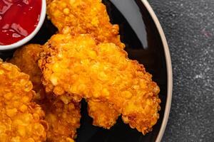 Chicken nuggets in breaded deep fried fresh tasty food dish delicious gourmet food background on the table rustic food top view space photo