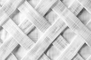 White fabric strips intertwined creating modern geometric pattern photo