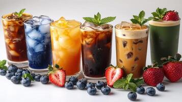 A vibrant array of iced drinks beautifully presented with fresh berries and mint photo