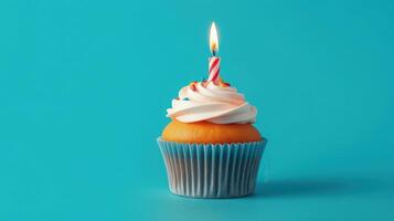 Colorful cupcake with a candle celebrates a birthday in a vibrant setting photo