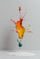 Vibrant paint splash in mid air, creating a colorful explosion against a white background photo