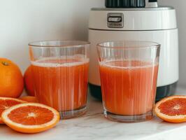 Freshly squeezed orange juice in glasses with oranges photo