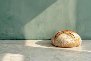 Artisan sourdough bread on marble surface, rustic kitchen setting photo