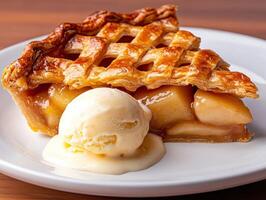 A slice of warm apple pie with a scoop of vanilla ice cream. photo