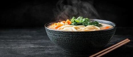 Steaming bowl of udon noodle soup with vegetables photo