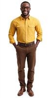 A man in a yellow shirt and brown pants photo