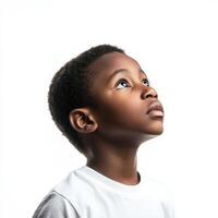 A young boy looking up at something photo