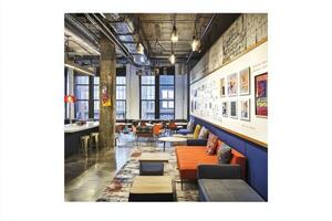 A photo of an office with orange and blue furniture