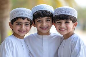 Three boys in white clothing posing for a photo