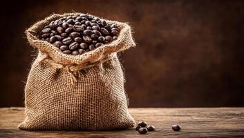 Coffee Beans in a Burlap Sack on Wooden Table photo