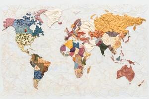 Patchwork textile world map showcasing diverse cultures and regions intricately designed with various fabric patterns in an artistic representation of global geography photo