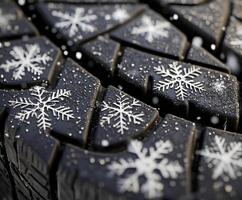 Winter tires with snowflake patterns showcase grip and safety in cold weather conditions photo