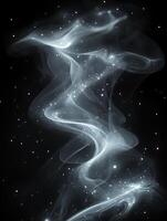 Smoke and dust creating abstract shapes on black background photo