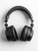 Modern headphones lying on a gray background photo