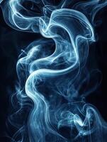 Smoke creating abstract shapes on a black background photo