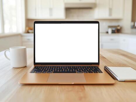 Modern mocha colored laptop showing blank screen on wooden table with coffee mug and notepads photo