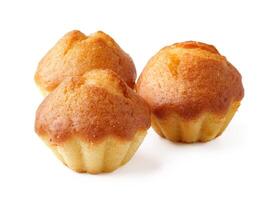 Delicious homemade mini cakes arranged on a white background, perfect for dessert or snack time photo