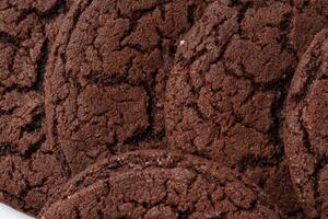 Chocolate cookies baked to perfection with a rich, textured surface showcasing their soft interior photo