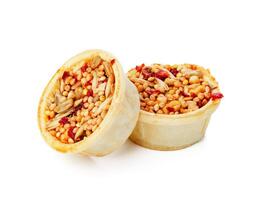 Nutritious seed mix served in a bowl with additional snacks for pet at home photo